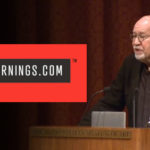 Speaker delivering a talk at a CreativeMornings.com event, standing at a podium with a red and black logo displayed