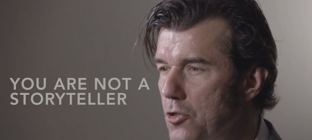 Close-up of a man speaking passionately with text overlay: ‘YOU ARE NOT A STORYTELLER’ in bold white font