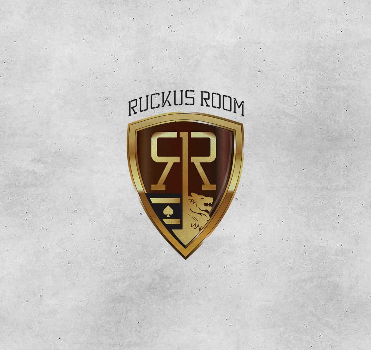 Ruckus Room - Ruckus Room Logo featuring a gold shield design with a lion and spade emblem