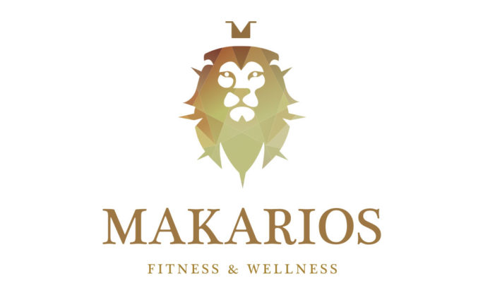 Makarios - Makarios Fitness & Wellness logo featuring a geometric lion head design with a crown, symbolizing strength and health, in gradient gold hues on a white background