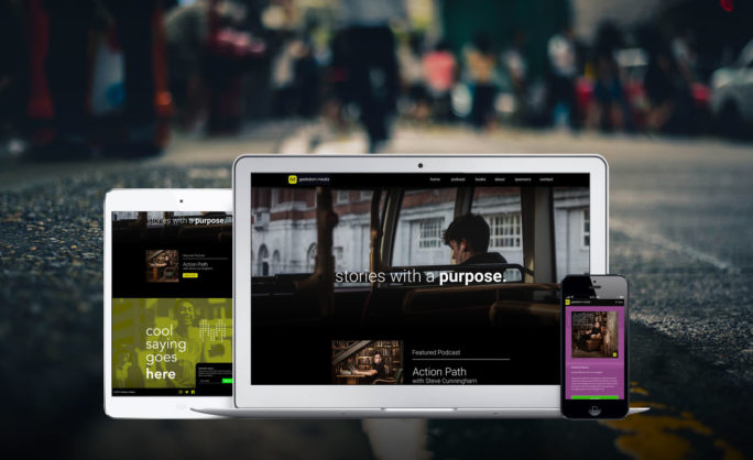 Geekdom Media - This image features multiple devices—tablet, laptop, and smartphone—showing a responsive website design with the tagline "stories with a purpose." The blurred city street background adds depth, emphasizing the modern and versatile design approach for digital platforms.