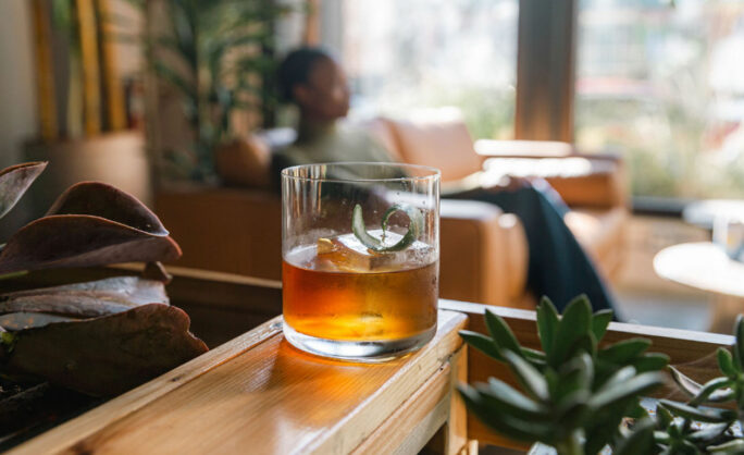 a glass of liquid on a table