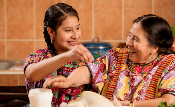 a woman and a girl smiling