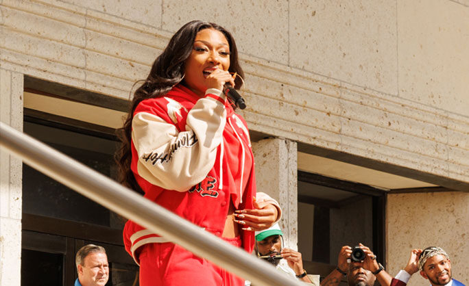 a woman singing into a microphone